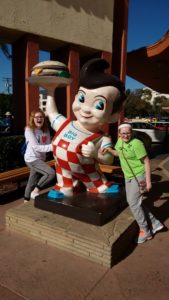 The girls posing next to the Big Boy statue